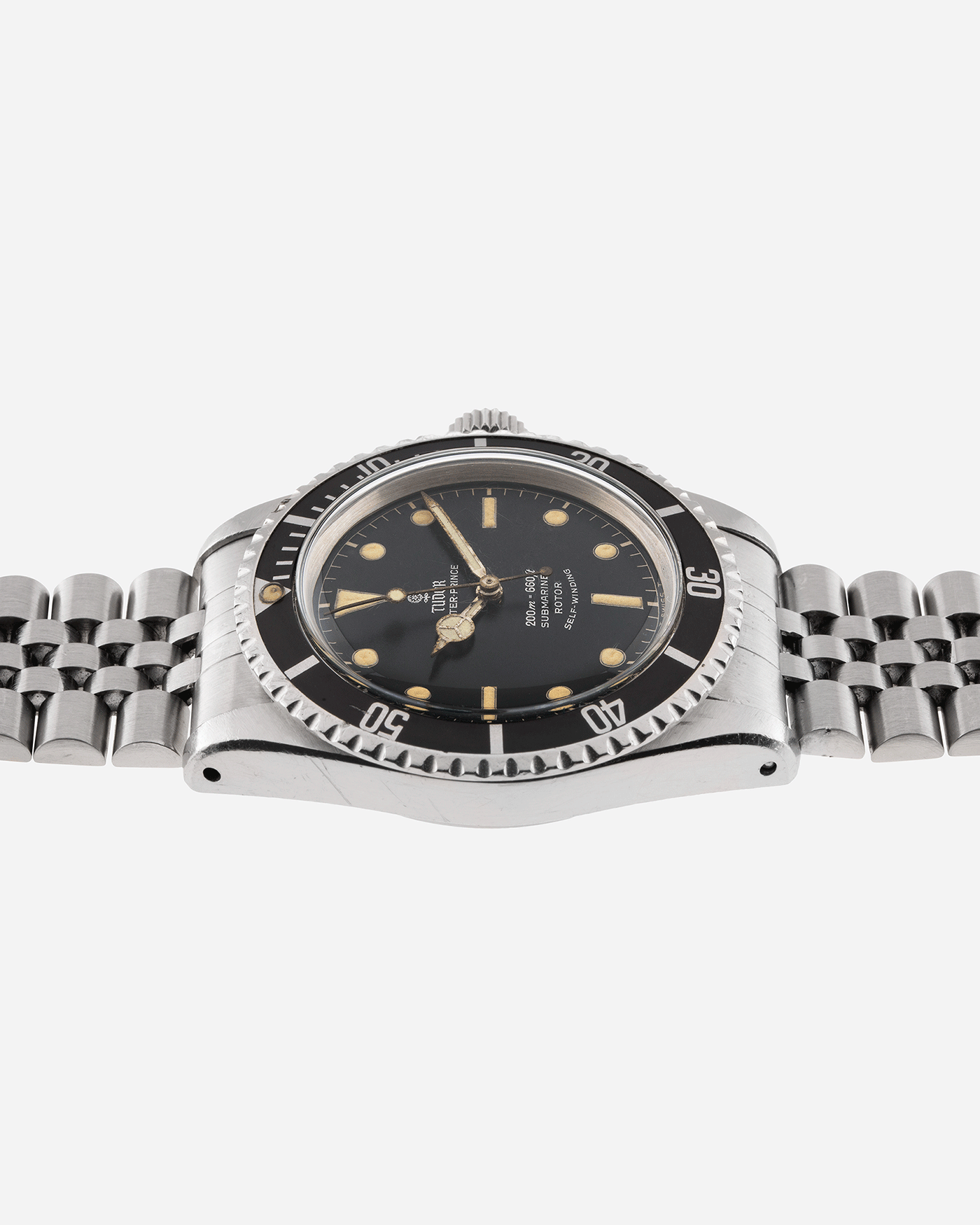 Brand: Tudor Year: 56XXXX Model: Submariner Reference Number: 7928 Serial Number: 1966 Material: Stainless Steel Movement: Cal. 390 Case Diameter: 39mm Lug Width: 20mm Bracelet: Rolex 62510H Jubilee with 555B End Links