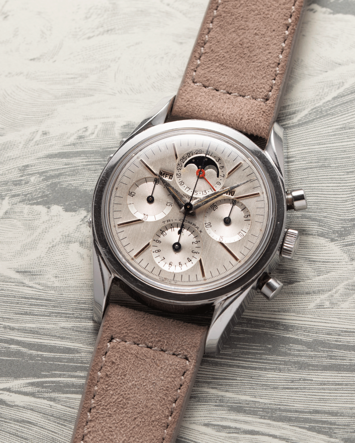Brand: Universal Geneve Year: 1960’s Reference Number: 222100 Material: Stainless Steel Movement: Cal. 281 Case Diameter: 36mm Lug Width: 18mm Strap: Molequin Taupe Nubuck and Stainless Steel Buckle