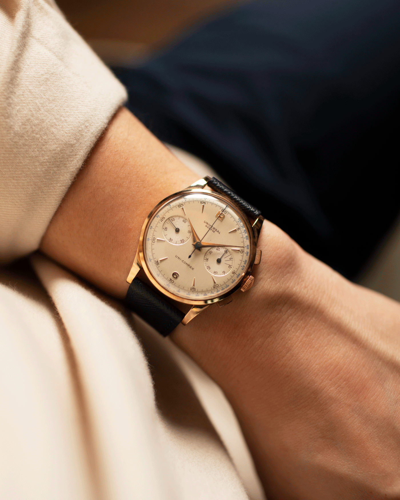 Brand: Universal Geneve Year: 1950’s Model: Uni-Compax Reference Number: 124103 Serial Number: 1550986 Material: 18k Pink Gold Movement: UG Cal. 285 Case Diameter: 37mm Lug Width: 20mm Bracelet/Strap: Molequin Navy Blue Textured Calf