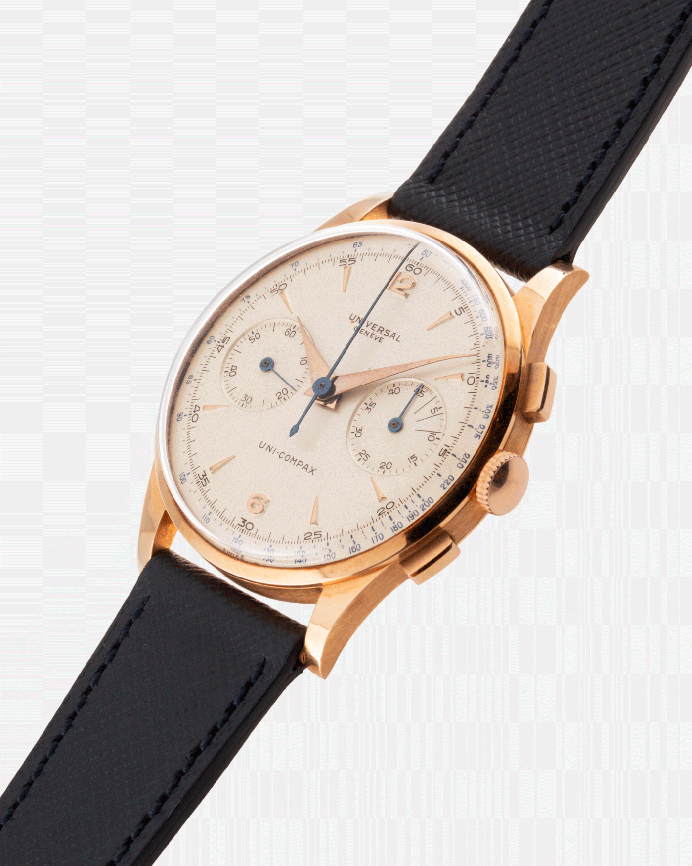 Brand: Universal Geneve Year: 1950’s Model: Uni-Compax Reference Number: 124103 Serial Number: 1550986 Material: 18k Pink Gold Movement: UG Cal. 285 Case Diameter: 37mm Lug Width: 20mm Bracelet/Strap: Molequin Navy Blue Textured Calf
