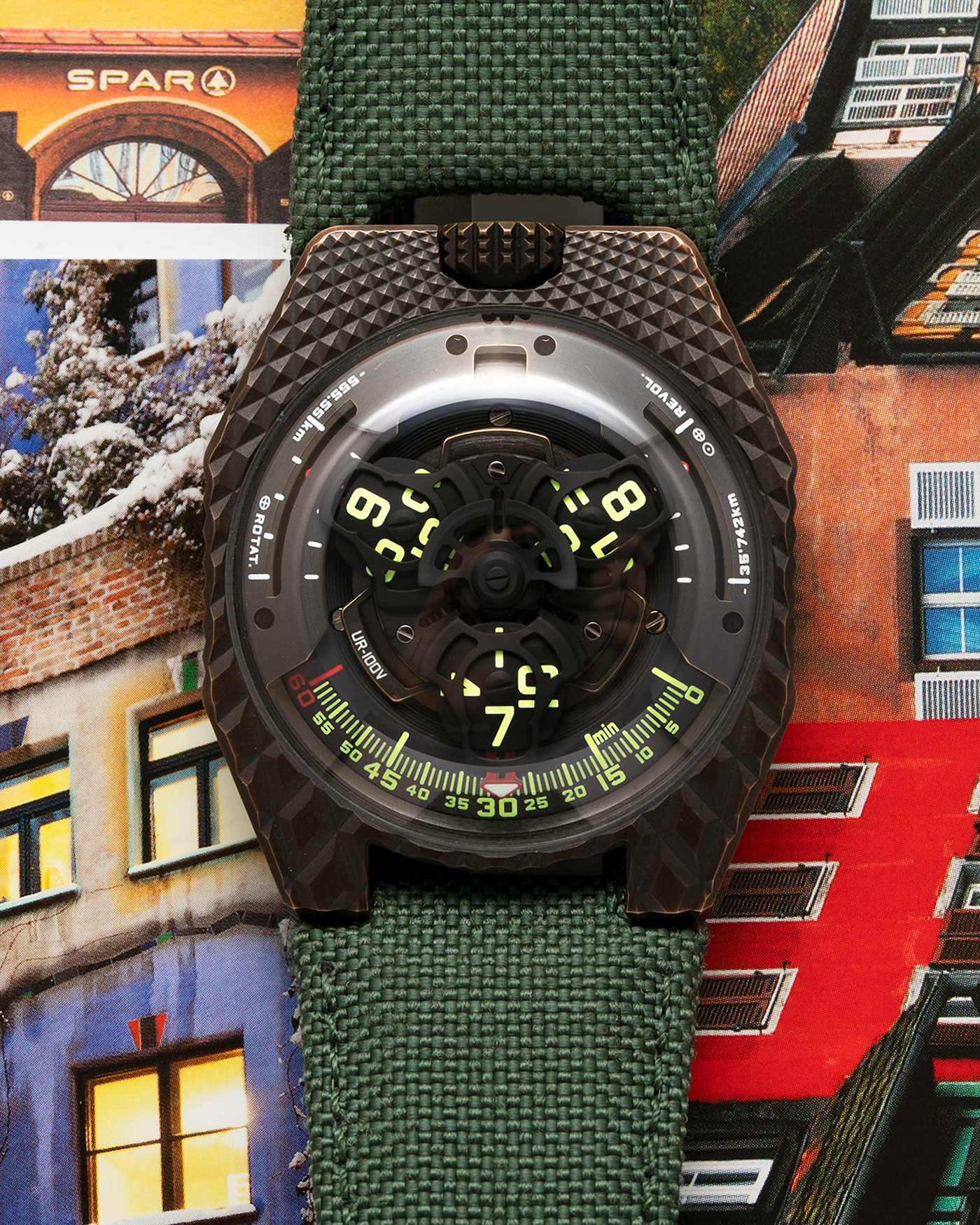 Brand: Urwerk Year: 2021 Model: UR100 T-Rex Material: Bronze Movement: Urwerk Cal. 12.01 Case Diameter: 41mm Bracelet/Strap: Urwerk Army Green Textile Strap