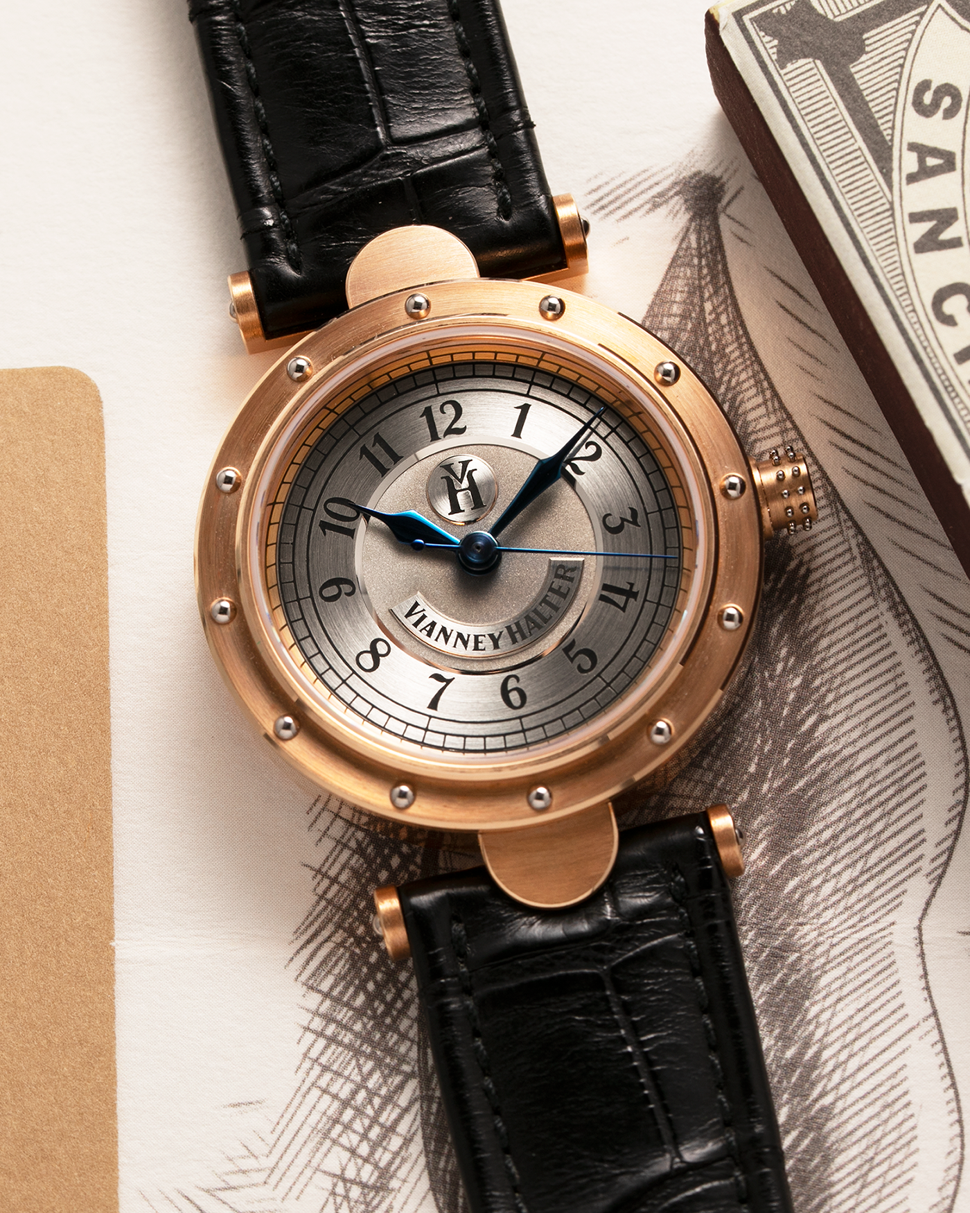 Brand: Vianney Halter Year: 2000’s Model: Classic Material: 18k Rose Gold Movement: Modified Lemania 8810 with mystery motor Case Diameter: 36mm Bracelet/Strap: Vianney Halter Black Alligator with matching Rose Gold Buckle