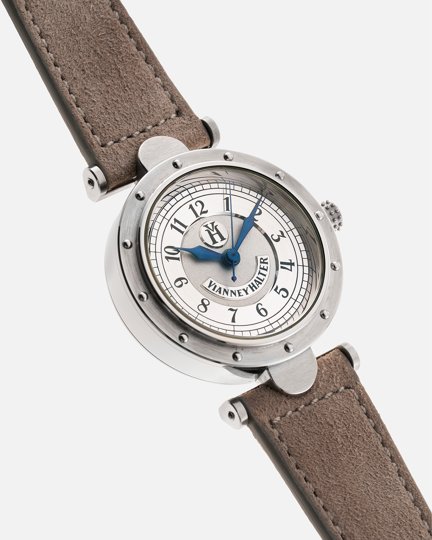 Brand: Vianney Halter Year: 2000’s Model: Classic Material: 18k White Gold Movement: Modified Lemania 8810 with mystery motor Case Diameter: 36mm Bracelet/Strap: Molequin Taupe Suede with 18k White Gold Tang Buckle 