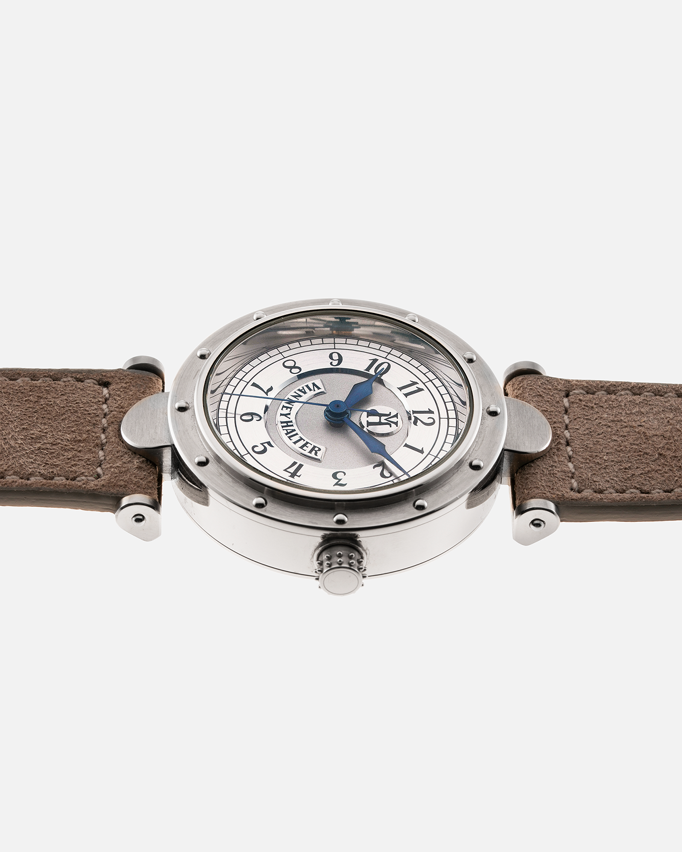 Brand: Vianney Halter Year: 2000’s Model: Classic Material: 18k White Gold Movement: Modified Lemania 8810 with mystery motor Case Diameter: 36mm Bracelet/Strap: Molequin Taupe Suede with 18k White Gold Tang Buckle 