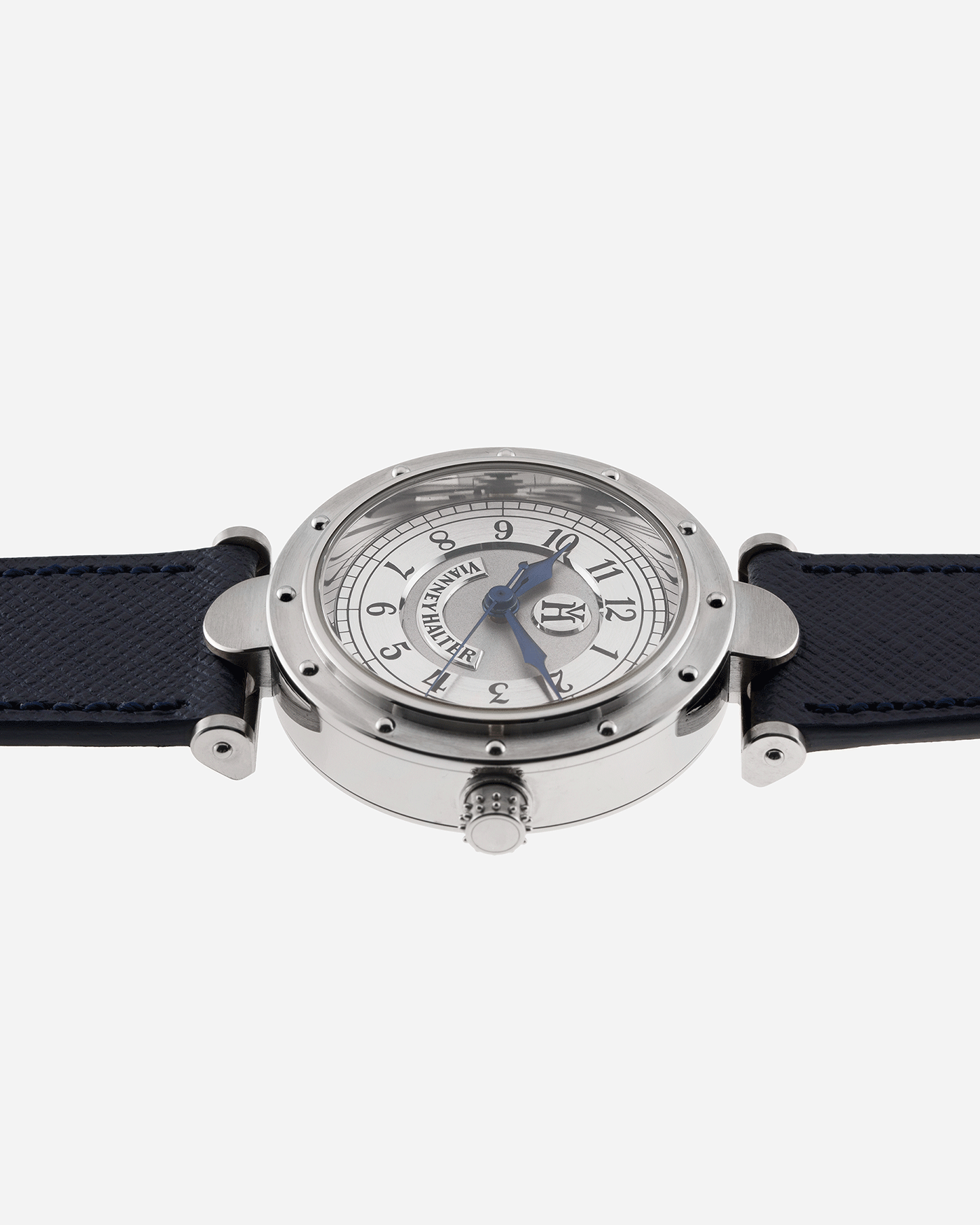 Brand: Vianney Halter Year: 2000’s Model: Classic Material: 18k White Gold Movement: Modified Lemania 8810 with mystery motor Case Diameter: 36mm Bracelet/Strap: Vianney Halter Black Alligator with matching White Gold Buckle and Navy Blue Molequin Textured Calf