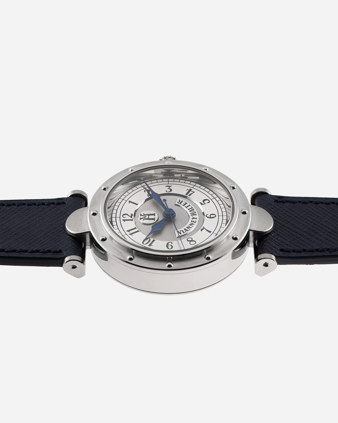 Brand: Vianney Halter Year: 2000’s Model: Classic Material: 18k White Gold Movement: Modified Lemania 8810 with mystery motor Case Diameter: 36mm Bracelet/Strap: Vianney Halter Black Alligator with matching White Gold Buckle and Navy Blue Molequin Textured Calf