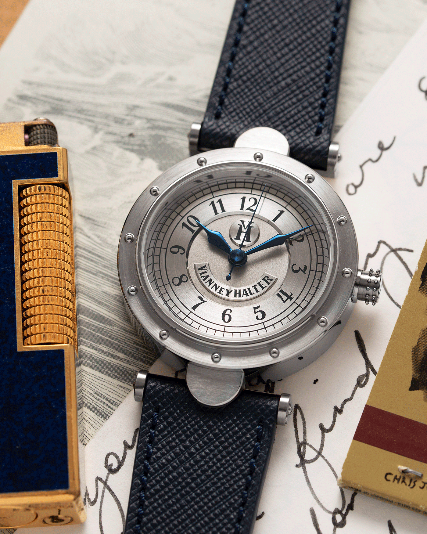 Brand: Vianney Halter Year: 2000’s Model: Classic Material: 18k White Gold Movement: Modified Lemania 8810 with mystery motor Case Diameter: 36mm Bracelet/Strap: Vianney Halter Black Alligator with matching White Gold Buckle and Navy Blue Molequin Textured Calf
