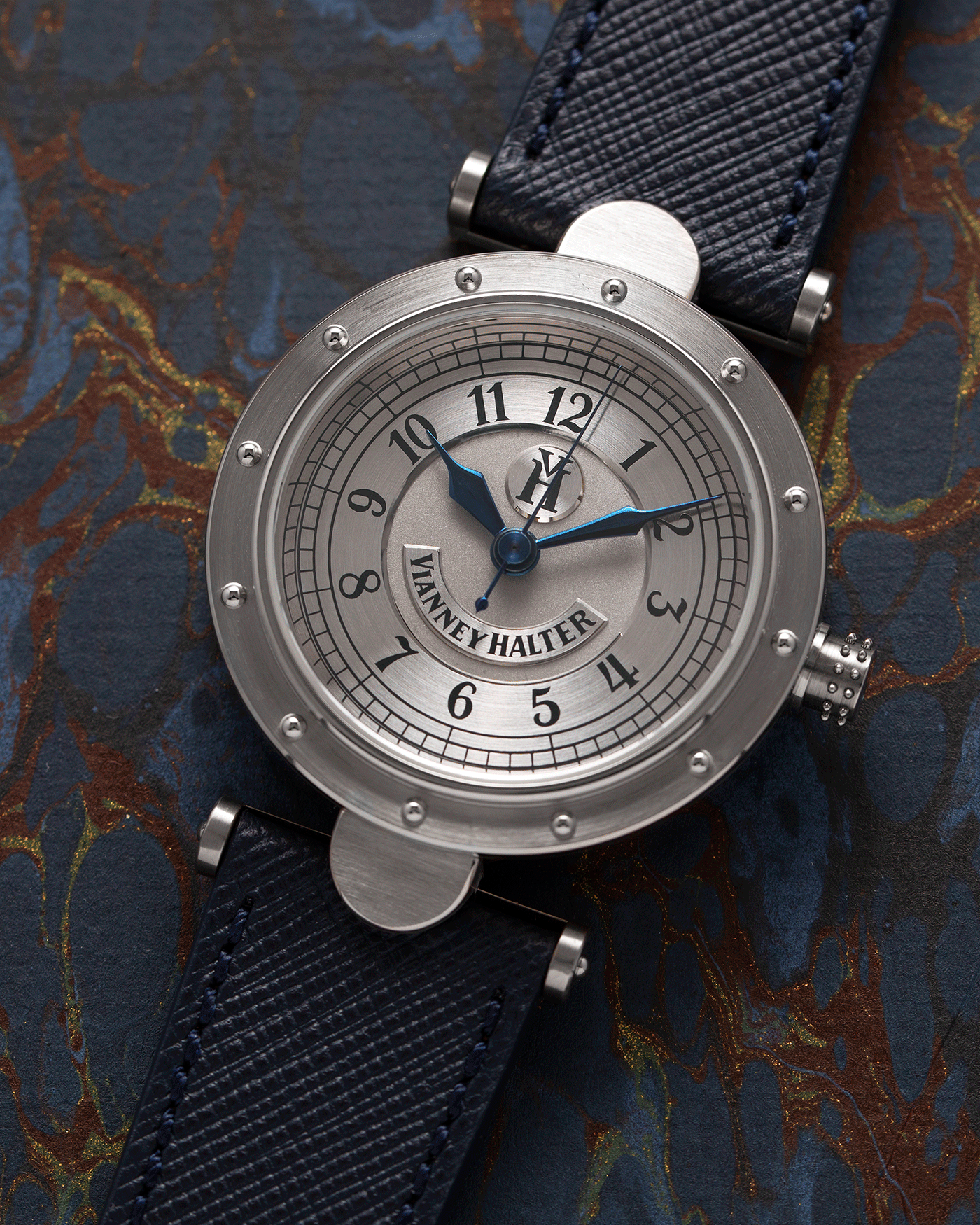Brand: Vianney Halter Year: 2000’s Model: Classic Material: 18k White Gold Movement: Modified Lemania 8810 with mystery motor Case Diameter: 36mm Bracelet/Strap: Vianney Halter Black Alligator with matching White Gold Buckle and Navy Blue Molequin Textured Calf
