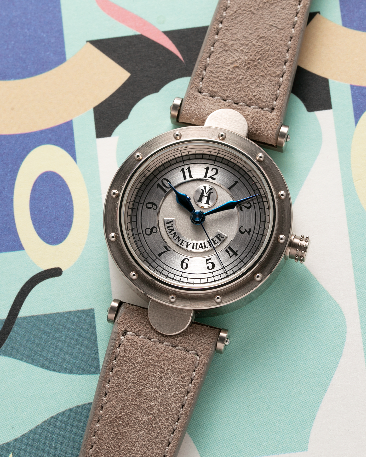 Brand: Vianney Halter Year: 2000’s Model: Classic Material: 18k White Gold Movement: Modified Lemania 8810 with mystery motor Case Diameter: 36mm Bracelet/Strap: Molequin Taupe Suede with 18k White Gold Tang Buckle 