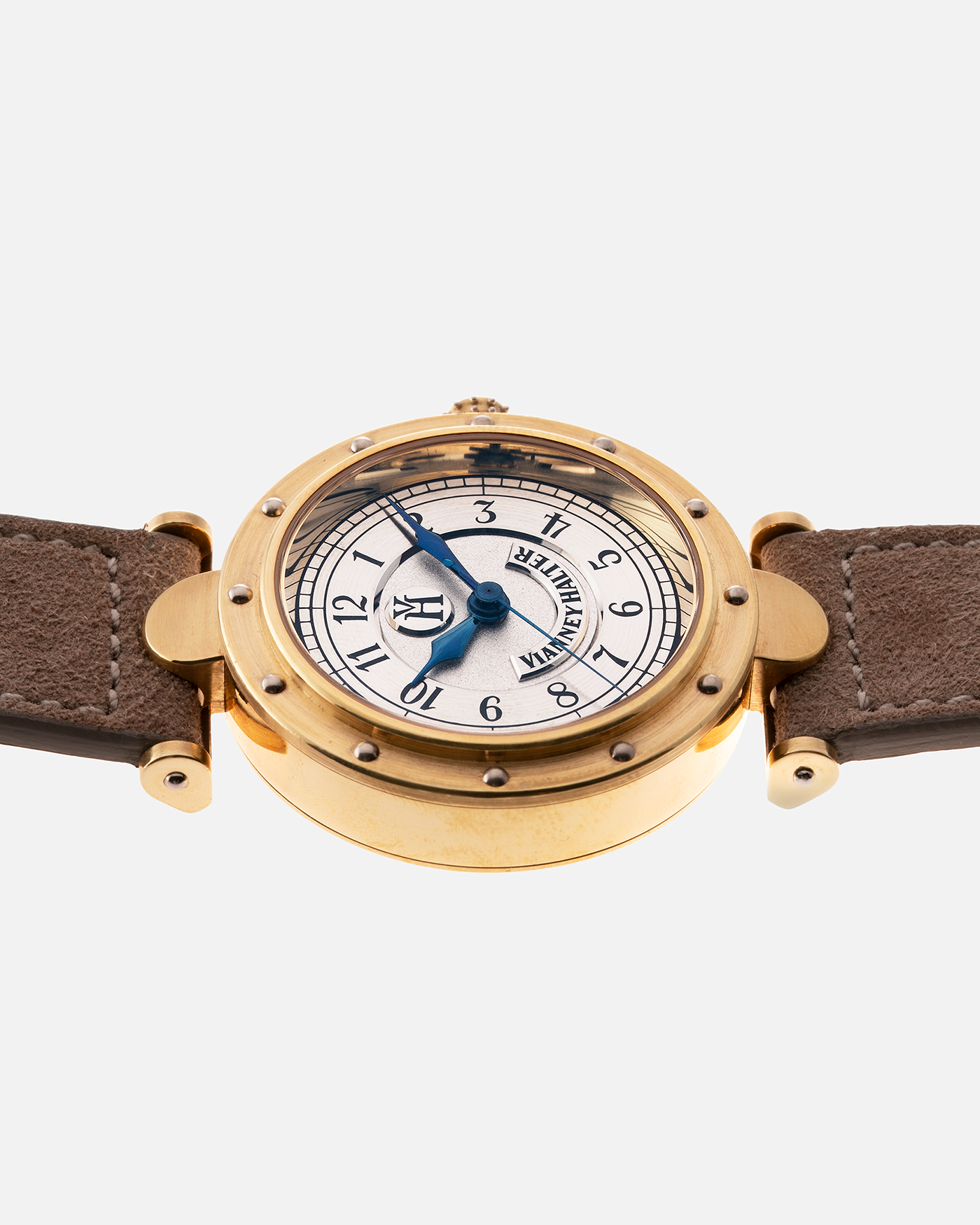 Brand: Vianney Halter Year: 2000’s Model: Classic Material: 18k Yellow Gold Movement: Modified Lemania 8810 with mystery motor Case Diameter: 36mm Bracelet/Strap: Molequin Beige Suede with matching Yellow Gold Buckle