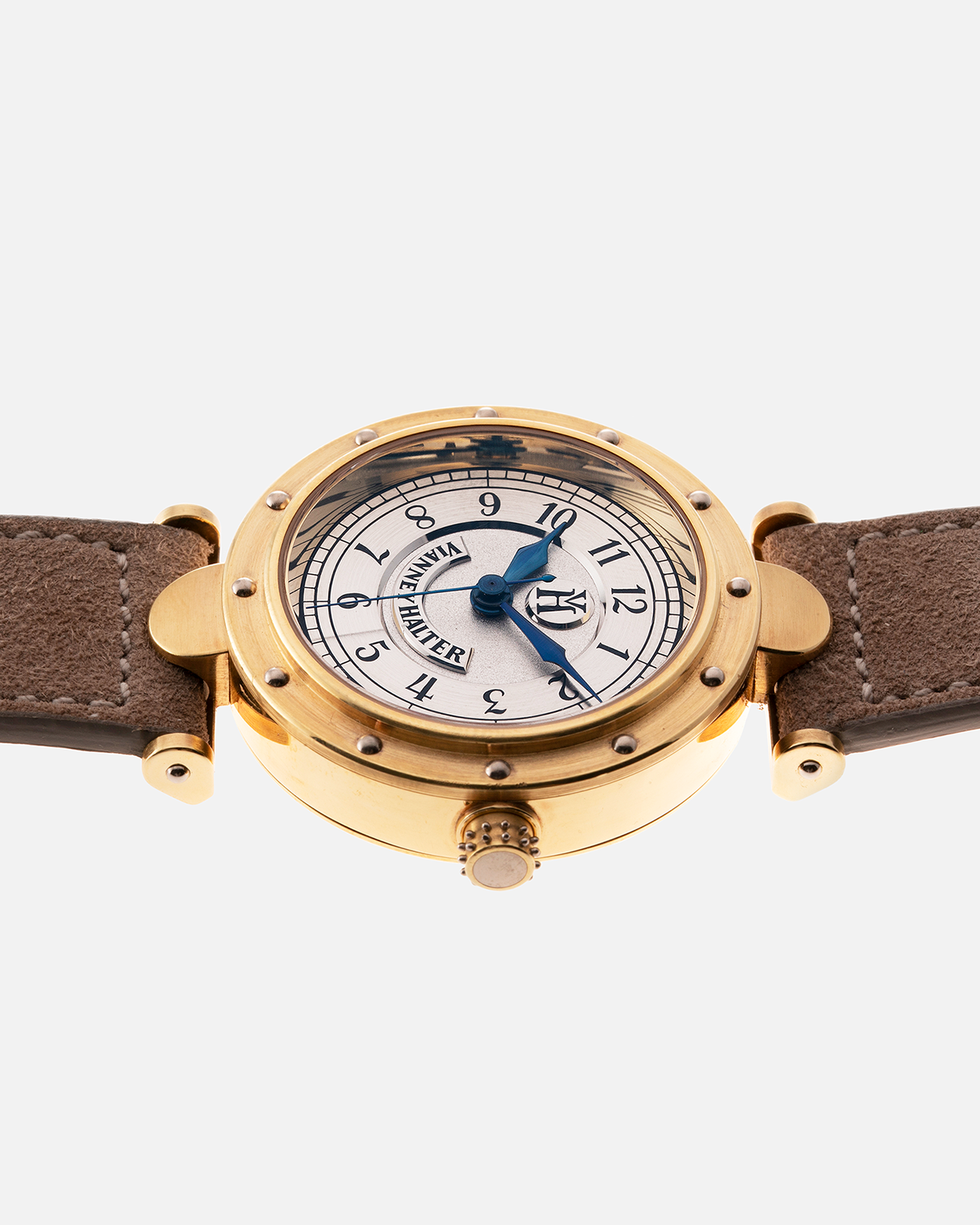 Brand: Vianney Halter Year: 2000’s Model: Classic Material: 18k Yellow Gold Movement: Modified Lemania 8810 with mystery motor Case Diameter: 36mm Bracelet/Strap: Molequin Beige Suede with matching Yellow Gold Buckle